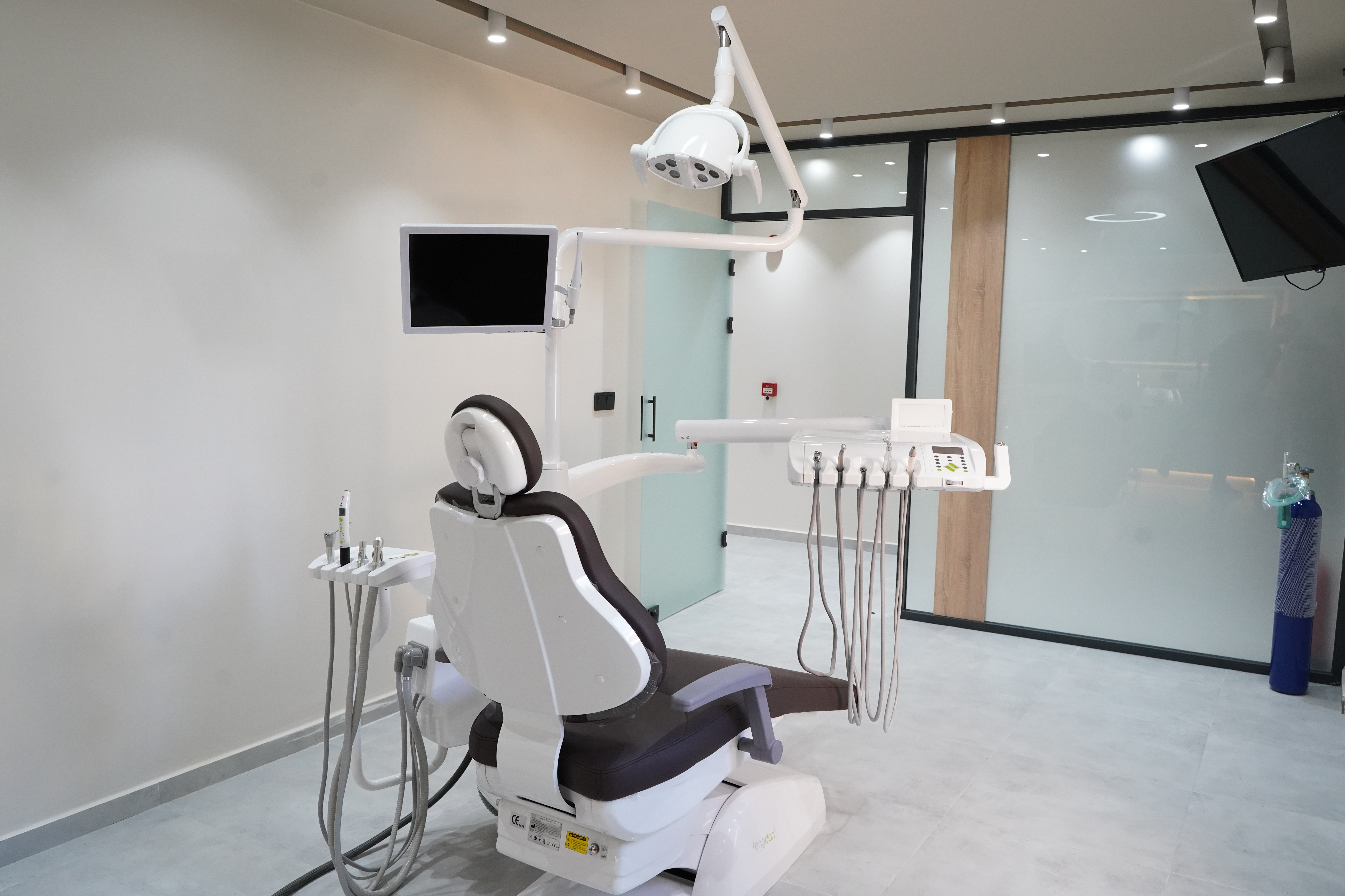 Modern dental chair with overhead monitor